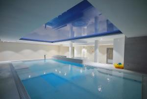 a large swimming pool in a house at Hotel Hel in Hel