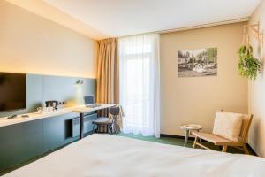 Postel nebo postele na pokoji v ubytování Green Park Hotel Brugge
