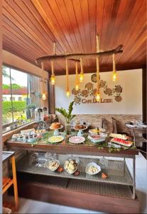 a buffet with a lot of food on a table at Pousada da Leide in Fernando de Noronha