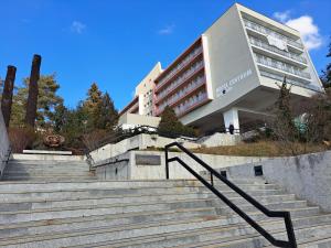 a building with stairs in front of a building at Hotel Centrum Brno in Brno