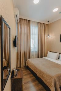 Postel nebo postele na pokoji v ubytování Moss Art Boutique Hotel