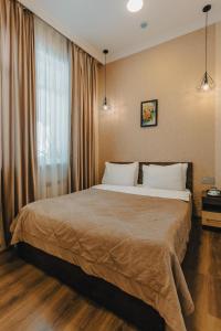 Ένα ή περισσότερα κρεβάτια σε δωμάτιο στο Moss Art Boutique Hotel