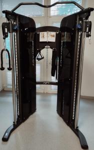 a gym rack with a bunch of equipment at Hotel Centrum Brno in Brno