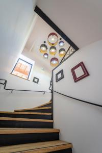 a staircase in a house with black and white ceilings at Château de Loubéjac in Montauban