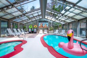 a pool with a pink flamingo in the middle at Christmas Farm Inn and Spa in Jackson