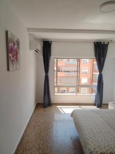 En eller flere senge i et værelse på City Centre apartments + 24 billeder