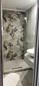 a bathroom with a shower and a sink at House Anna Sarti in Sarti +57 photos