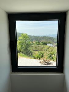 a window in a room with a view at Casa do Borges 
