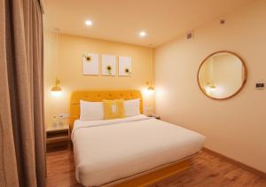 Postel nebo postele na pokoji v ubytování Bloom Hotel - Jalandhar