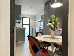 a kitchen and dining room with a table and chairs at The Art Luxury Home in Florence +23 photos