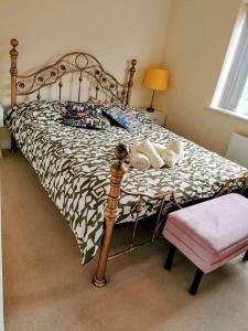 a bedroom with a large bed with at House with Breath of Fresh Air in Bloxwich