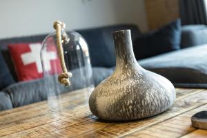a vase sitting on top of a wooden table at Chalet Kookaburra in La Tzoumaz +24 photos