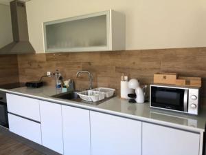 Kuchyň nebo kuchyňský kout v ubytování Viana do Castelo - Amonde Village -Casa A * Relax