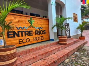 a building with a sign that reads entranceros ego hotel at Eco Hotel Entre Ríos in Villeta