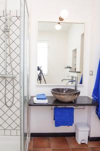 a bathroom with a sink and a mirror at Chiara House in Levanto