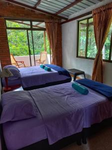 Postel nebo postele na pokoji v ubytování Eco Hotel Entre Ríos