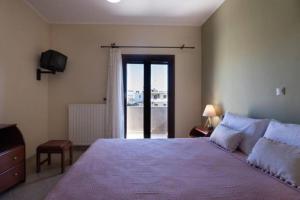 Posteľ alebo postele v izbe v ubytovaní Terpsis House
