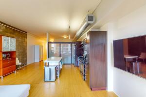 a large room with a kitchen and a living room at Life is Grand in Los Angeles