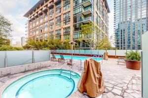 a swimming pool on the roof of a building at Life is Grand in Los Angeles