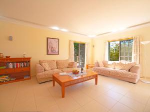 a living room with two couches and a coffee table at Holiday Home Montinho by Interhome in Loulé