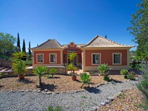 a house with a lot of plants in front of it at Holiday Home Montinho by Interhome in Loulé