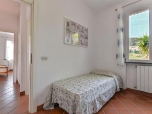 A bed or beds in a room at Holiday Home Wendy by Interhome