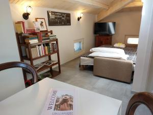 a room with a bed and a table with a book at Circo Massimo Apartment & Terrace in Rome
