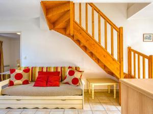 a bedroom with a bed under a staircase at Holiday Home Les Grandes Bleues 3 by Interhome in Narbonne-Plage