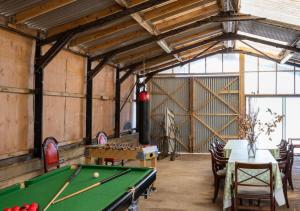 a billiard room with a pool table in it at Barn Owl Oxley Dairy in Hollesley