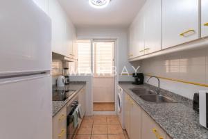 Kuchyň nebo kuchyňský kout v ubytování Apartamento Geneve
