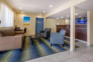 a lobby with a waiting room with chairs and a desk at Travelodge by Wyndham Charles Town - Harpers Ferry in Charles Town