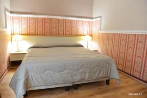 Posteľ alebo postele v izbe v ubytovaní Catania Centro Rooms