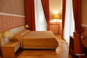 Posteľ alebo postele v izbe v ubytovaní Catania Centro Rooms