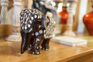 a figurine of an elephant sitting on a table at Chalet Mont Rose in La Tzoumaz +20 photos