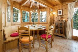 a dining room with a table and chairs at Chalet Mont Rose in La Tzoumaz