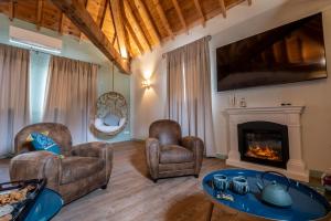 Posezení v ubytování Le Belvédère Hotel et Bien être