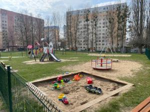 a playground in a park with a play set at Noclegi Murzynowskiego in Olsztyn