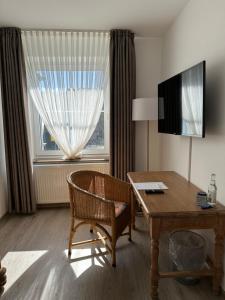 TV a/nebo společenská místnost v ubytování Hotel Wittekindsquelle