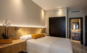 Posteľ alebo postele v izbe v ubytovaní Hotel Barrameda