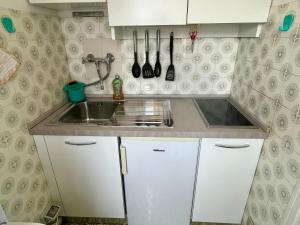 Kuchyň nebo kuchyňský kout v ubytování Casa Di Rosa