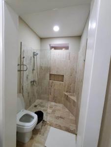 a bathroom with a shower with a toilet and a shower at Best ocean view Sosua-Cabarete in Sosúa