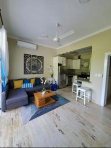 a living room with a couch and a table at Best ocean view Sosua-Cabarete in Sosúa