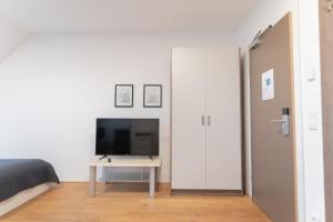 TV a/nebo společenská místnost v ubytování Hotel Triester