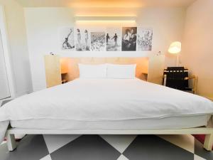 Ένα ή περισσότερα κρεβάτια σε δωμάτιο στο The Asbury Hotel