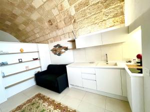 Kuchyň nebo kuchyňský kout v ubytování B&B Suite Amare Polignano