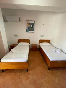 Rúm í herbergi á Hotel Rai