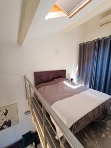 Posteľ alebo postele v izbe v ubytovaní Joli Duplex cathédrale