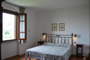 a bedroom with a bed and a window at Casa Vacanze Poggio Aprico in Venturina Terme +66 photos