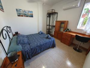 Łóżko lub łóżka w pokoju w obiekcie Rico Apartaments Ricosol