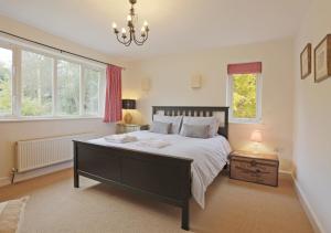 מיטה או מיטות בחדר ב-Meadow Lodge